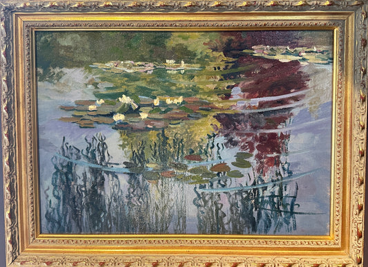 Monet's Water Lilies  II is painting in an ornate French gold frame. The impressionist artwork depicts green lily pads, white flowers, and blue water reflections, set against a dark background.