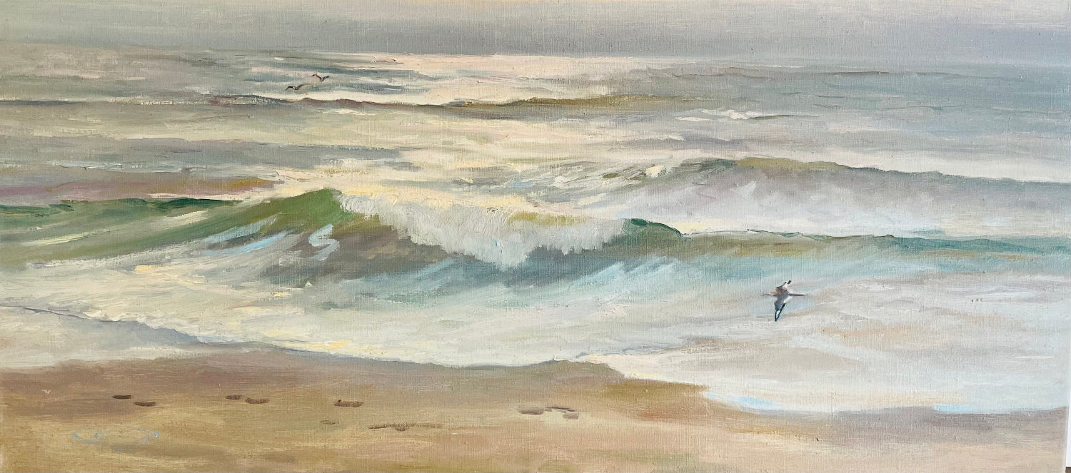 An impressionistic painting of ocean waves rolling onto a sandy beach, with a small surfer figure near the right side of the water.